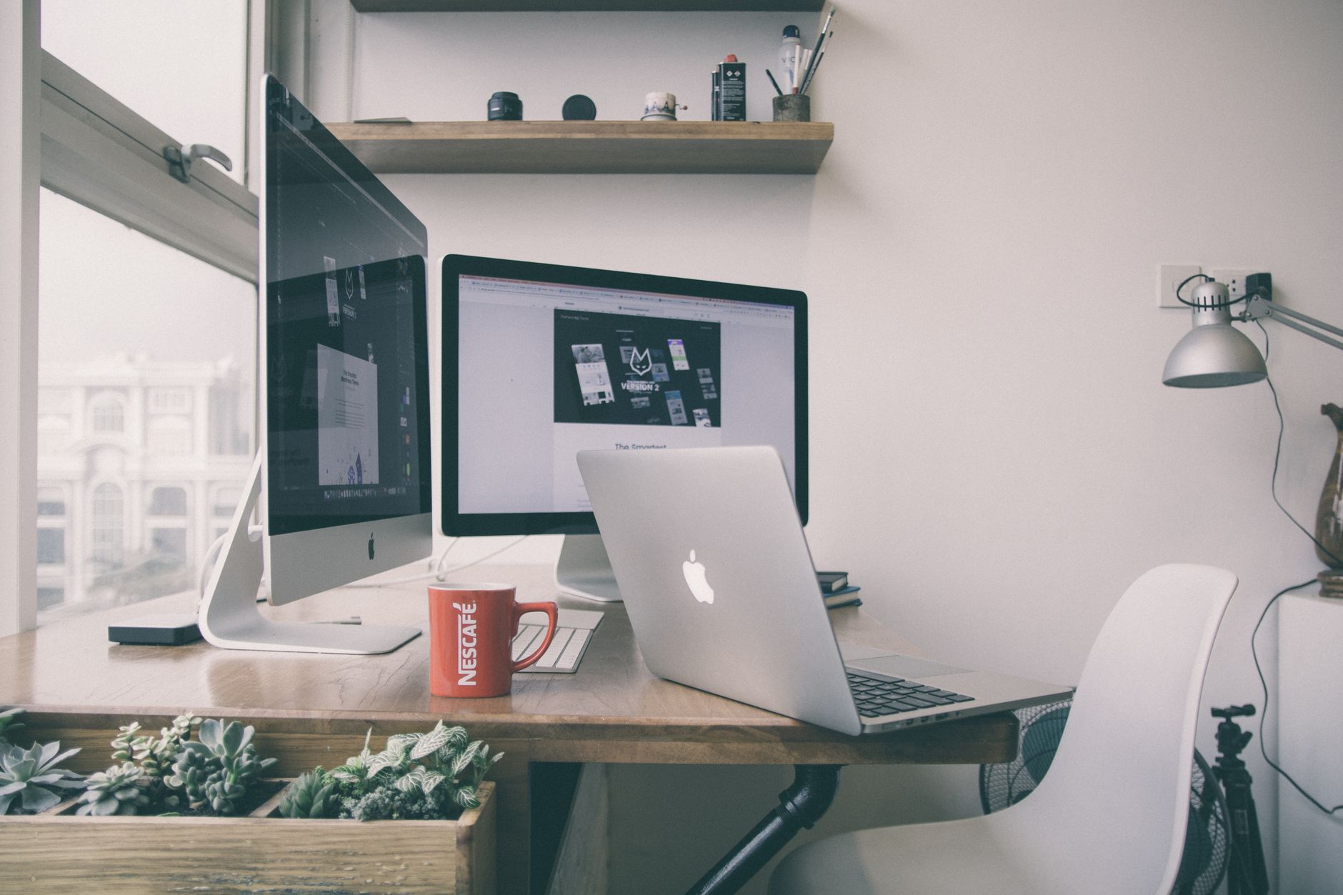 Laptop and desktop monitor in a home workspace